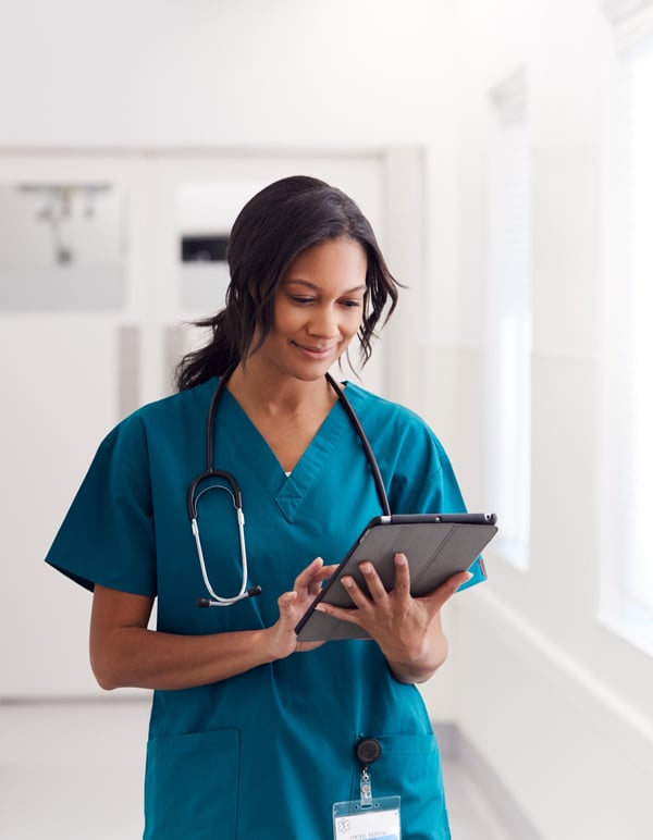 woman doctor nurse looking at tablet woman doctor nurse looking at tablet